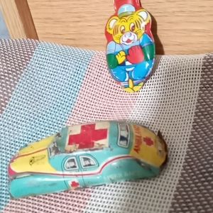 Antique tin toy car and clicker  rare hard to find. Collector's item.